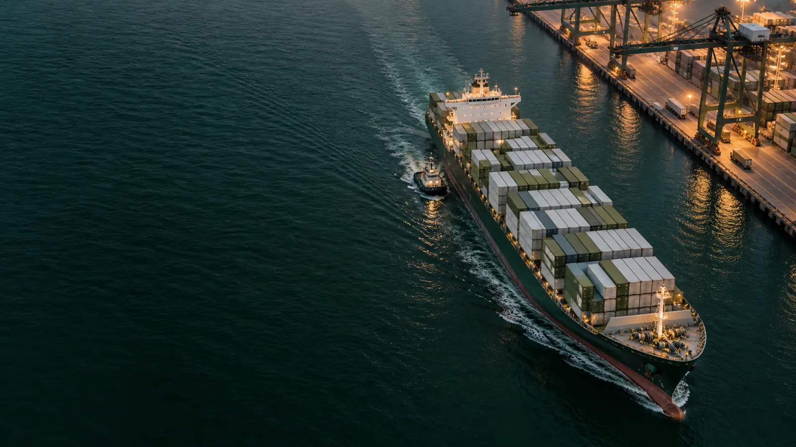 Concept image of a cargo vessel moving through deep green water